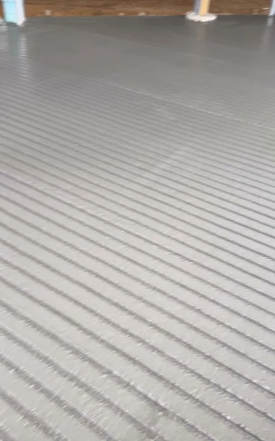 Even broom finish across a newly poured concrete floor